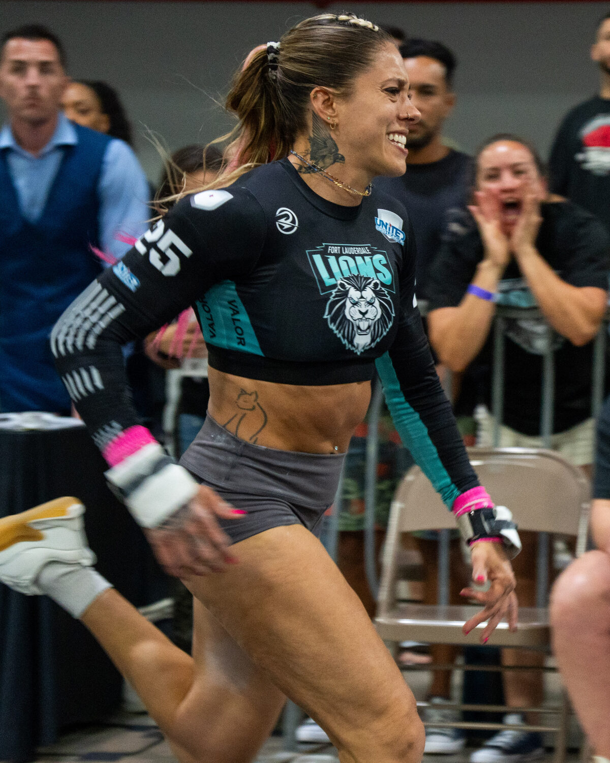 A Fort Lauderdale Lions player sprints down the lane in front of the crowd during a 2026 match.